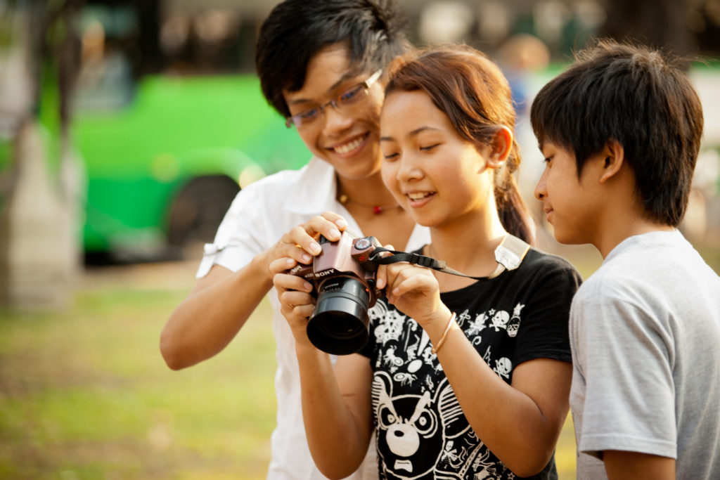 Teaching a photography workshop in Cambodia to teens at Water of Life orphanage by Me Ra Koh.