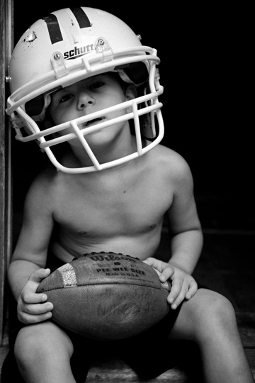 Black and White Football Photo of Little boy by Kelli Kalish