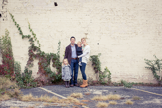 family portrait with ivy on brick wall