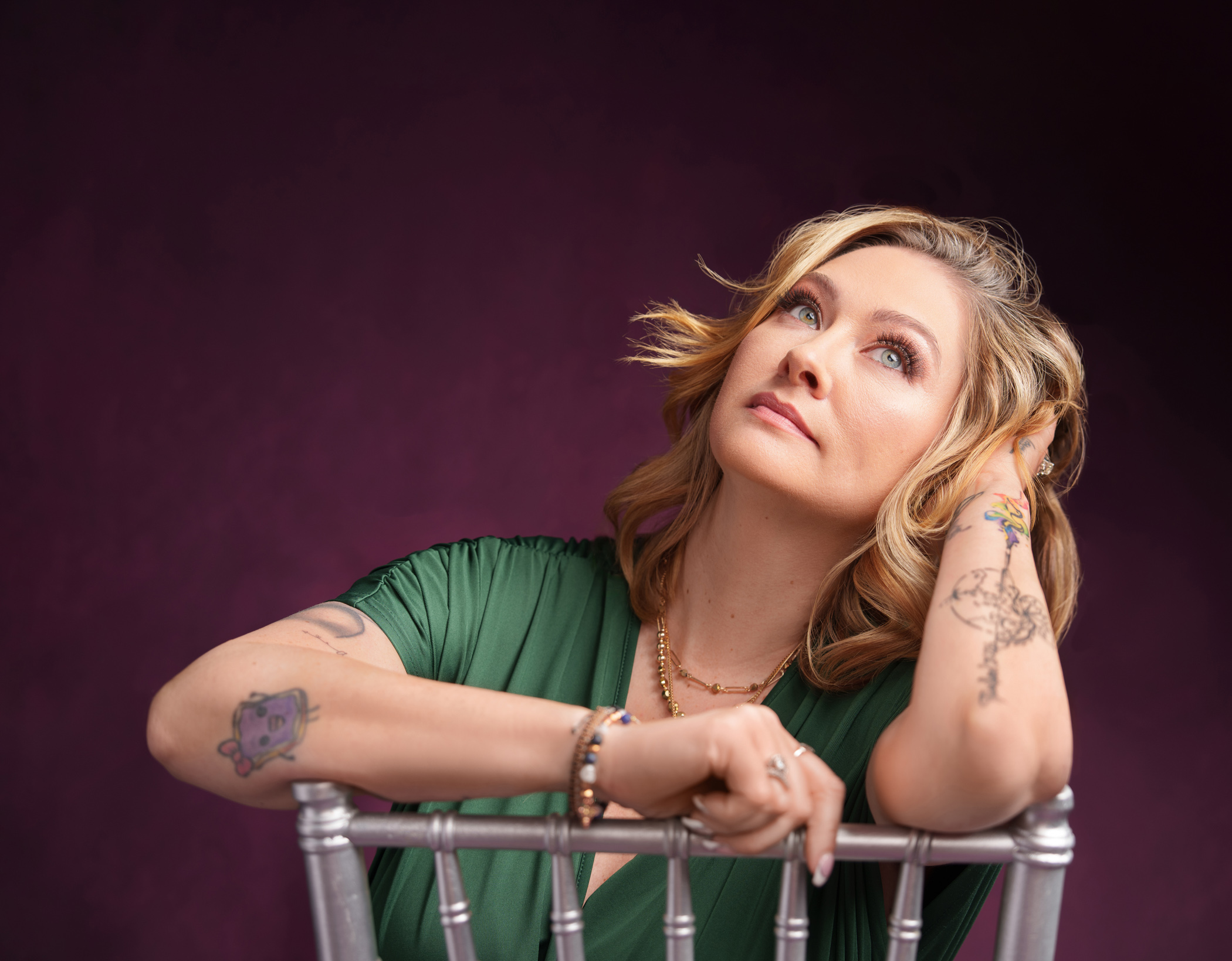 Mikki Schumacher looking upward in quiet reflection during her Rising Phoenix Experience, a portrait taken as she considered who she truly is outside of being everyone else's strength.