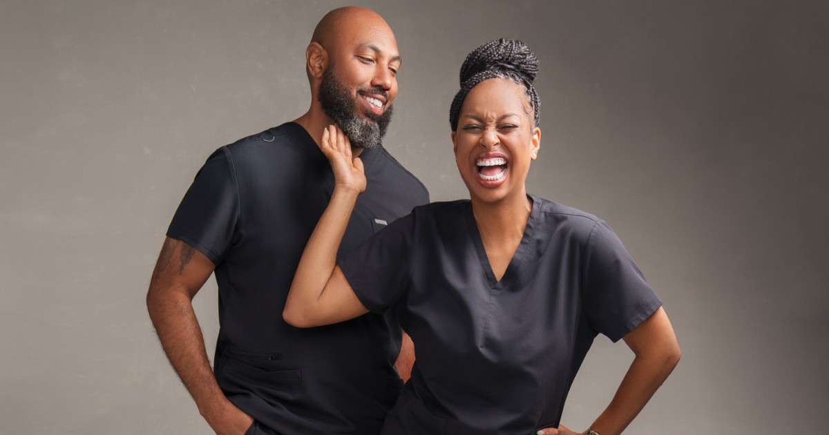 Chase and Brandon of Texas Trim Clinic sharing a playful moment during their Brand Authority Experience in Frisco, Texas.